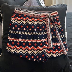 Small faux wrap around polyester skort.